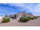 Beautiful exterior view showcasing a single-story home with desert landscaping and a tiled roof at 10720 Bennington Ct, Las Vegas, NV 89134
