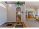 Inviting foyer with archway, chandelier, and views into the living and dining areas at 10720 Bennington Ct, Las Vegas, NV 89134