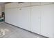 Spacious garage with white storage cabinets along the wall, offering ample storage solutions at 10720 Bennington Ct, Las Vegas, NV 89134