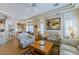 Open-concept living space with a breakfast bar and comfortable seating at 10720 Bennington Ct, Las Vegas, NV 89134