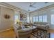 Inviting living room with comfortable seating, plantation shutters, and natural light at 10720 Bennington Ct, Las Vegas, NV 89134