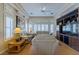 Spacious living room with coffered ceilings, plantation shutters, and a cozy seating area at 10720 Bennington Ct, Las Vegas, NV 89134