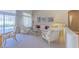 Bright living room offers stylish seating, natural light, and backyard access at 10720 Bennington Ct, Las Vegas, NV 89134
