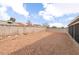 Expansive gravel backyard offers low-maintenance landscaping with a block wall for privacy at 117 Saint Albans Ct, Henderson, NV 89015