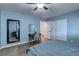 Bedroom featuring a workspace with a desk, ample closet space, and vinyl flooring at 117 Saint Albans Ct, Henderson, NV 89015