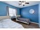 Cozy bedroom with twin beds and ceiling fan at 117 Saint Albans Ct, Henderson, NV 89015