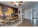 Well-lit dining area featuring city skyline mural, seating for six, and vinyl flooring at 117 Saint Albans Ct, Henderson, NV 89015