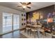 Dining room featuring a modern table and a Las Vegas-themed mural wall at 117 Saint Albans Ct, Henderson, NV 89015