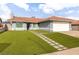 Attractive home with a tile roof and an expansive green lawn at 117 Saint Albans Ct, Henderson, NV 89015
