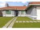 Charming home featuring a tile roof and an expansive artificial lawn at 117 Saint Albans Ct, Henderson, NV 89015