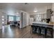 Open-concept kitchen with barstool seating, and seamlessly connecting to living spaces at 117 Saint Albans Ct, Henderson, NV 89015