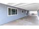 Large covered patio with concrete flooring and plenty of room for outdoor seating at 117 Saint Albans Ct, Henderson, NV 89015