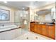 Bathroom boasts a soaking tub, glass shower, and vanity at 135 E Harmon Ave # 3704, Las Vegas, NV 89109