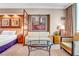 Stylish bedroom with a comfy seating area, a plush bed, and eye-catching art at 135 E Harmon Ave # 3704, Las Vegas, NV 89109
