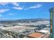 Expansive city view showing airport, mountains, and a clear blue sky at 135 E Harmon Ave # 3704, Las Vegas, NV 89109