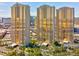 Stunning exterior view of MGM Signature towers with lush landscaping and circular driveway at 135 E Harmon Ave # 3704, Las Vegas, NV 89109