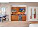The kitchenette has sleek countertops, wooden cabinets, a microwave, and a fridge at 135 E Harmon Ave # 3704, Las Vegas, NV 89109