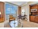 Inviting living area with kitchenette, seating, table, and striking panoramic city views at 135 E Harmon Ave # 3704, Las Vegas, NV 89109