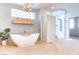 Spa-like bathroom featuring a freestanding tub and a modern walk-in shower at 1601 Fairgate Ct, Las Vegas, NV 89117