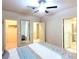 Spacious bedroom features multiple doorways and a walk-in closet, with a neutral color scheme throughout at 1601 Fairgate Ct, Las Vegas, NV 89117