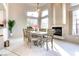 Light and airy dining room showcases a fireplace and an open floor plan at 1601 Fairgate Ct, Las Vegas, NV 89117