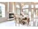 Dining room features a fireplace, large windows and seating for eight at 1601 Fairgate Ct, Las Vegas, NV 89117
