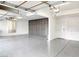 Clean and organized garage with epoxy floor, storage cabinets, and ample space for parking at 1601 Fairgate Ct, Las Vegas, NV 89117