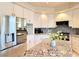 Bright kitchen features white cabinets, granite countertops and updated stainless steel appliances at 1601 Fairgate Ct, Las Vegas, NV 89117