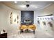A modern home office with custom shelving, unique decor, and ambient lighting at 1601 Fairgate Ct, Las Vegas, NV 89117