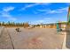 Expansive gravel backyard featuring an RV and plenty of space for outdoor activities and potential landscaping projects at 1720 S Blagg Rd, Pahrump, NV 89048