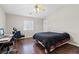 Bedroom featuring a ceiling fan and dark wood floors; great natural light at 1720 S Blagg Rd, Pahrump, NV 89048