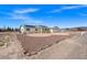 Charming single-story home with gravel front yard, solar panels and attached garage in a rural desert setting at 1720 S Blagg Rd, Pahrump, NV 89048