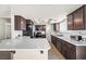 Modern kitchen featuring stainless steel appliances, ample counter space, and stylish dark wood cabinets at 1720 S Blagg Rd, Pahrump, NV 89048