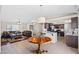 Expansive living space showcasing an open layout that connects the living room, dining area, and kitchen at 1720 S Blagg Rd, Pahrump, NV 89048