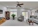 Bright living room with vaulted ceilings, neutral carpet, and a sliding glass door leading to the backyard at 2136 Eagle Sticks Dr. Dr, Henderson, NV 89012