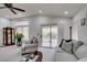 Bright living room with carpet, vaulted ceilings, and a sliding door for easy access to the outdoor space at 2136 Eagle Sticks Dr. Dr, Henderson, NV 89012