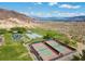 Overhead view of community park featuring tennis courts, playground, and beautiful mountain views at 217 Big Horn Dr # 3, Boulder City, NV 89005