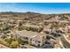 Panoramic aerial view of the neighborhood with tree-lined streets and mountain views at 217 Big Horn Dr # 3, Boulder City, NV 89005