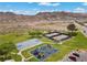 Aerial view of community park with tennis court, basketball court, and playground at 217 Big Horn Dr # 3, Boulder City, NV 89005