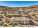 An aerial view of a residential community with tree-lined streets and mountain views at 217 Big Horn Dr # 3, Boulder City, NV 89005
