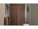 This bathroom features a curtained shower/tub and towel racks at 217 Big Horn Dr # 3, Boulder City, NV 89005