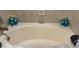 A relaxing bathtub is accented by candles and tile surround at 217 Big Horn Dr # 3, Boulder City, NV 89005