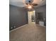 This bedroom features neutral carpet and opens to a closet and ensuite bathroom at 217 Big Horn Dr # 3, Boulder City, NV 89005