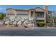 Charming two-story home with a rock-faced retaining wall and a two-car garage at 217 Big Horn Dr # 3, Boulder City, NV 89005