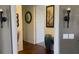 Elegant hallway with decorative sconces and art, leading to a bright and inviting space at 217 Big Horn Dr # 3, Boulder City, NV 89005