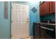 This laundry room includes a washer, dryer, and overhead cabinets at 217 Big Horn Dr # 3, Boulder City, NV 89005