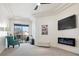 Bright living room boasts tray ceilings, an electric fireplace, and balcony access at 217 Big Horn Dr # 3, Boulder City, NV 89005