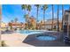 Beautiful community pool and hot tub with nearby seating at 217 Big Horn Dr # 3, Boulder City, NV 89005