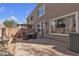 This backyard features a barbeque and green space at 223 Positive Point St, Henderson, NV 89012