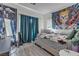 This bedroom features a tapestry and window at 223 Positive Point St, Henderson, NV 89012